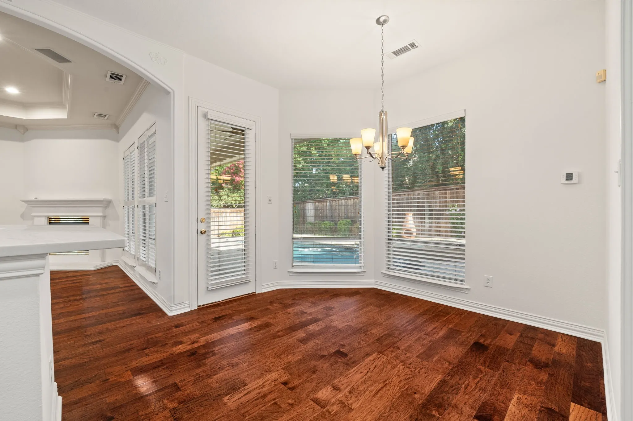 Hardwood-finish flooring paired with white walls