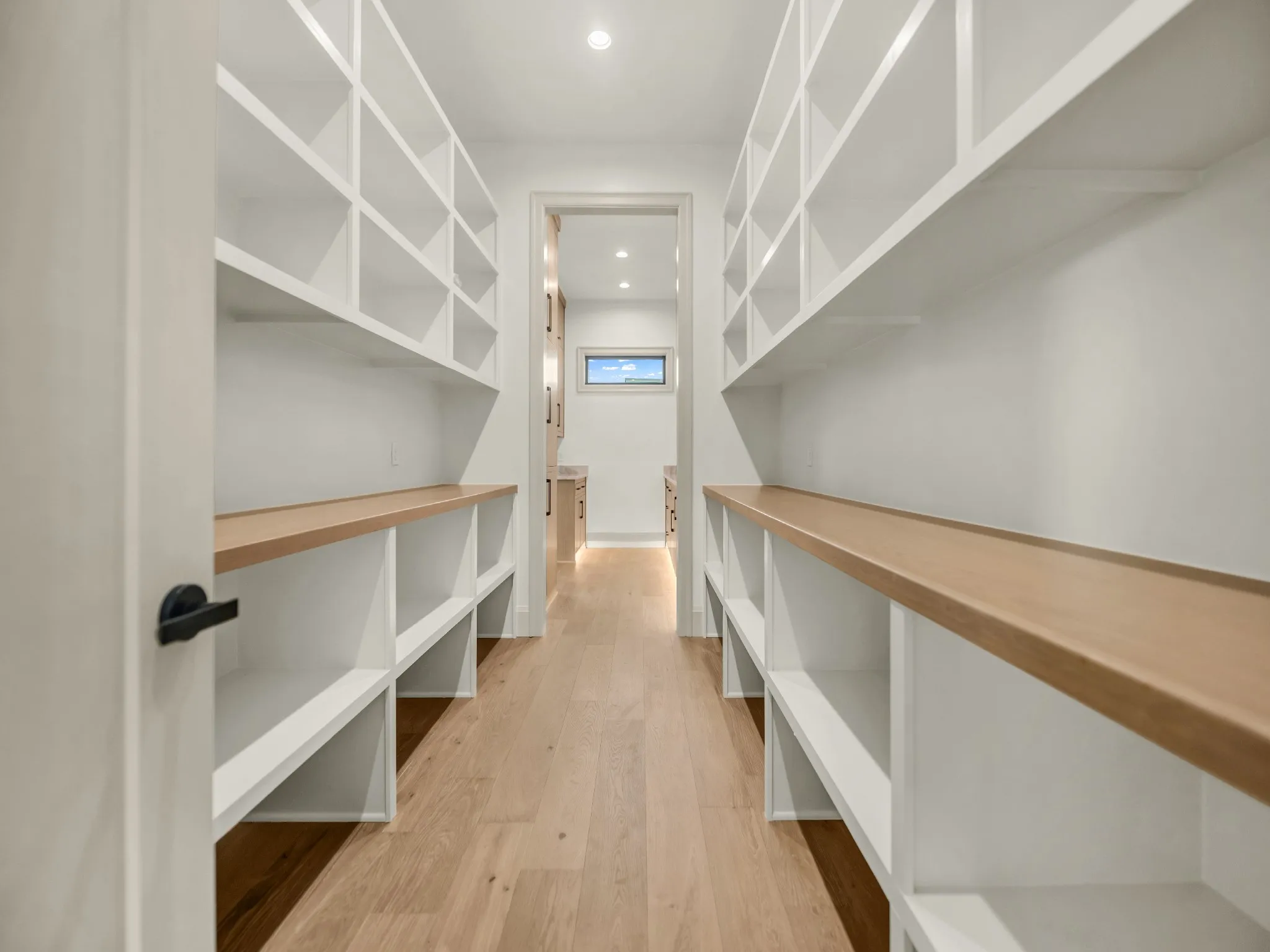 Separate from the prep-kitchen, with built-in shelving and storage.