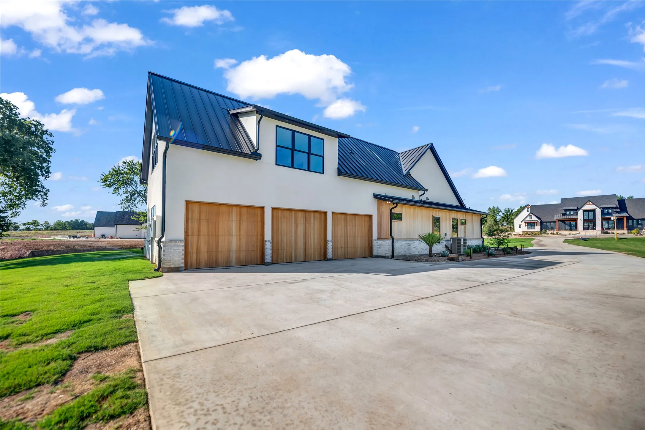 Exterior view of 3-car single garage doors.