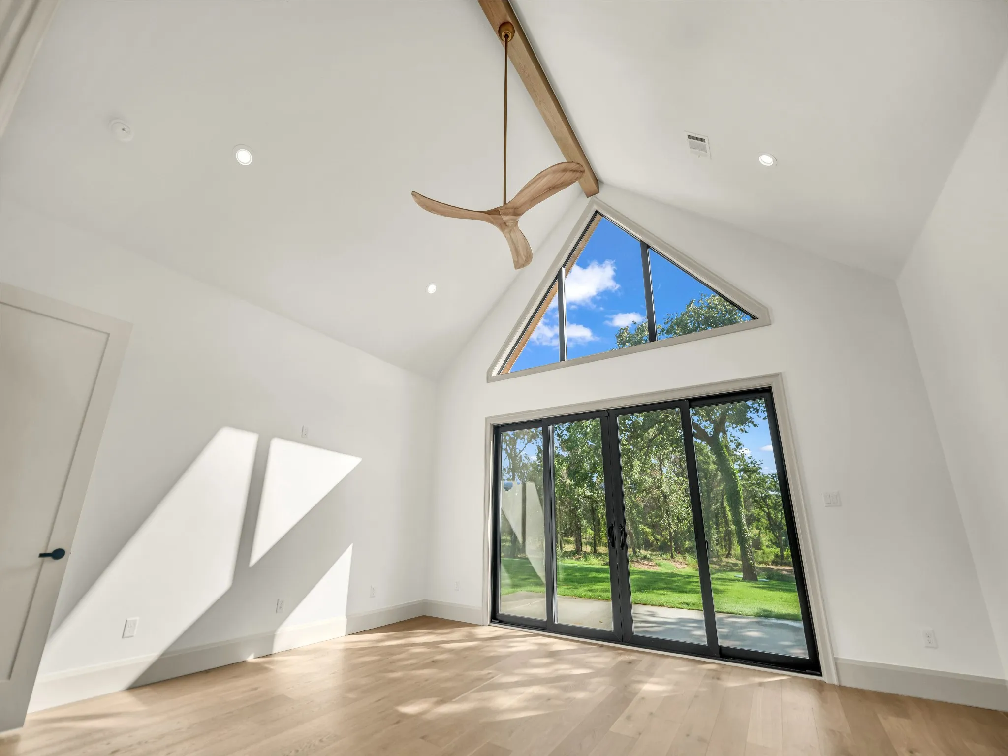 Gorgeous, natural lighting, in the primary suite, created by the large windows and sliding back door, which gives access to a private master patio.