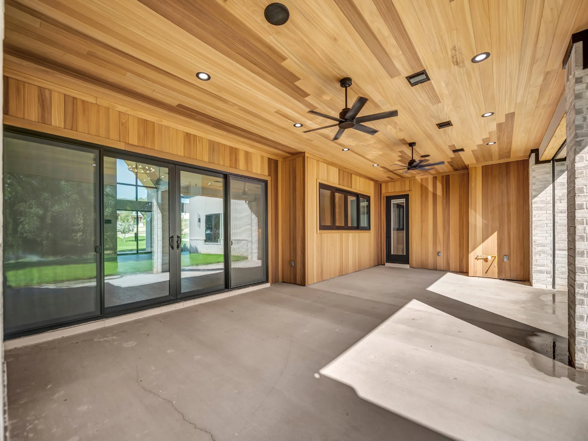 Massive patio sliders with two additional man doors for easy access to each side of the home.