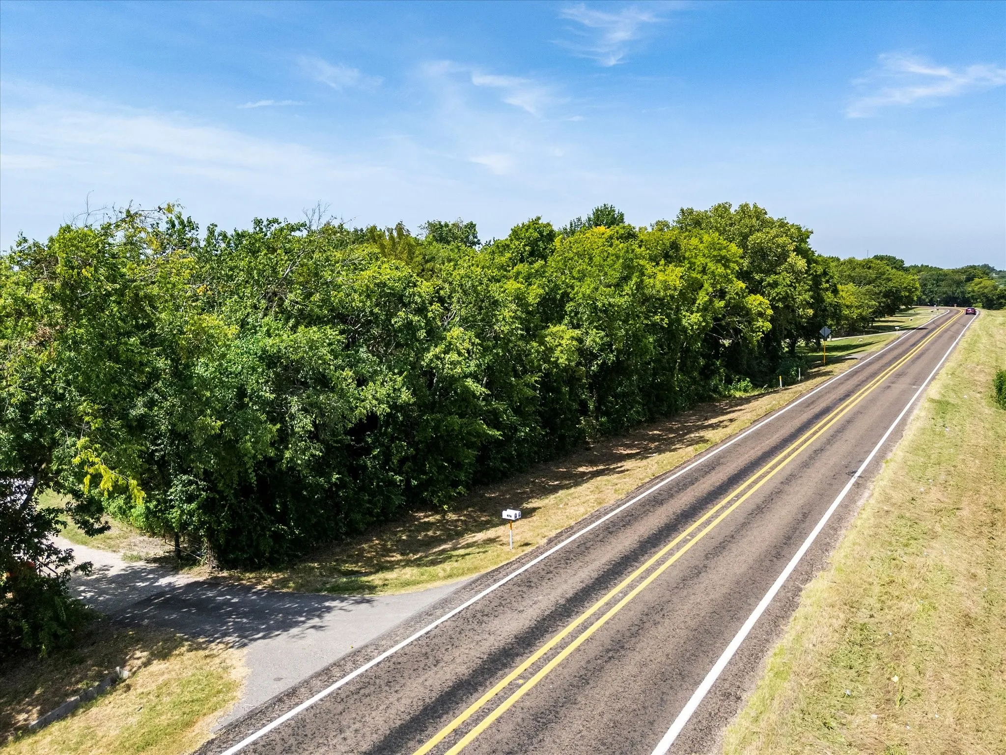 Driveway entrance - FM-2194 looking West towards Farmersville.
