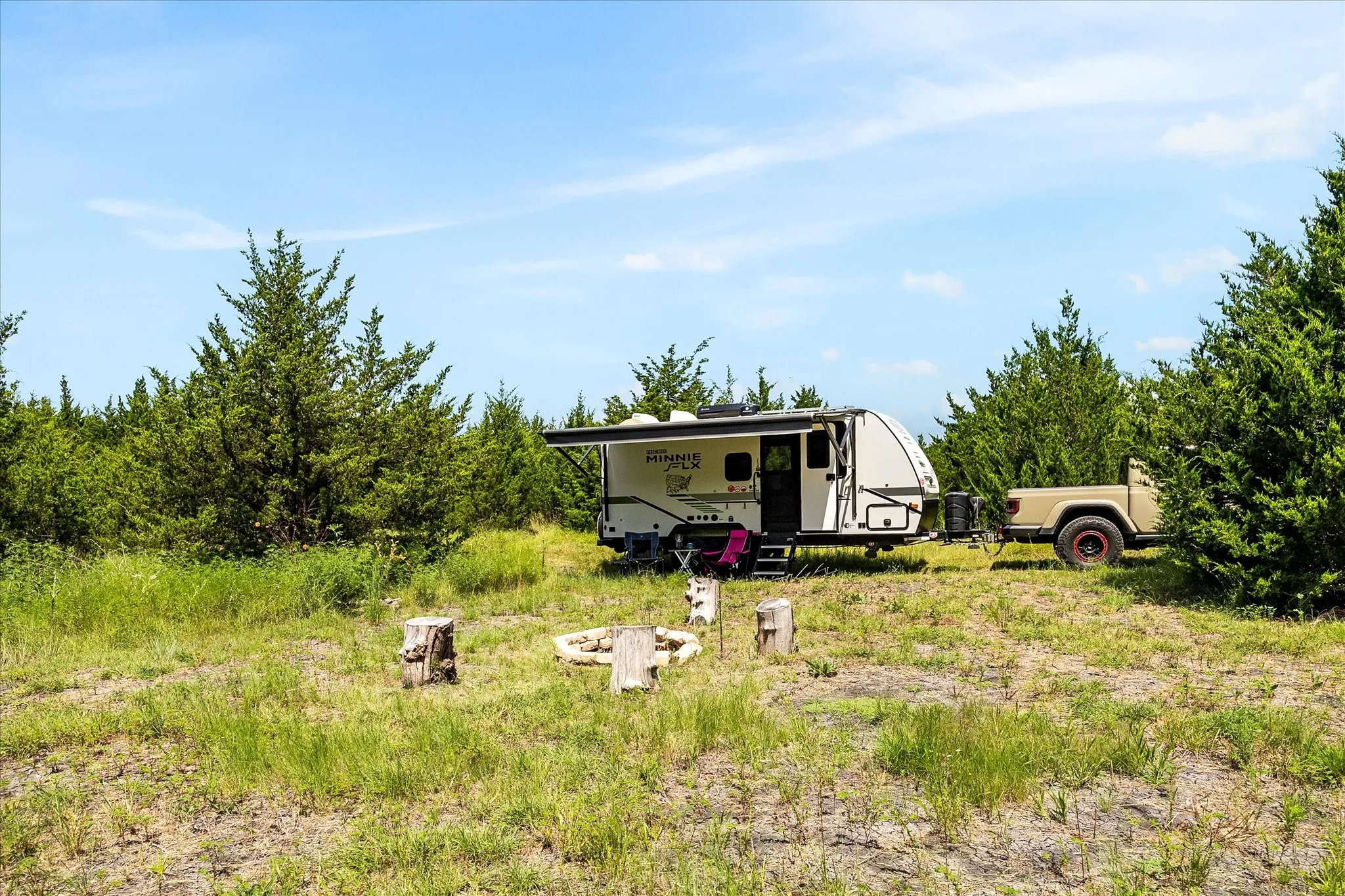 Dry camping site with campfire circle.