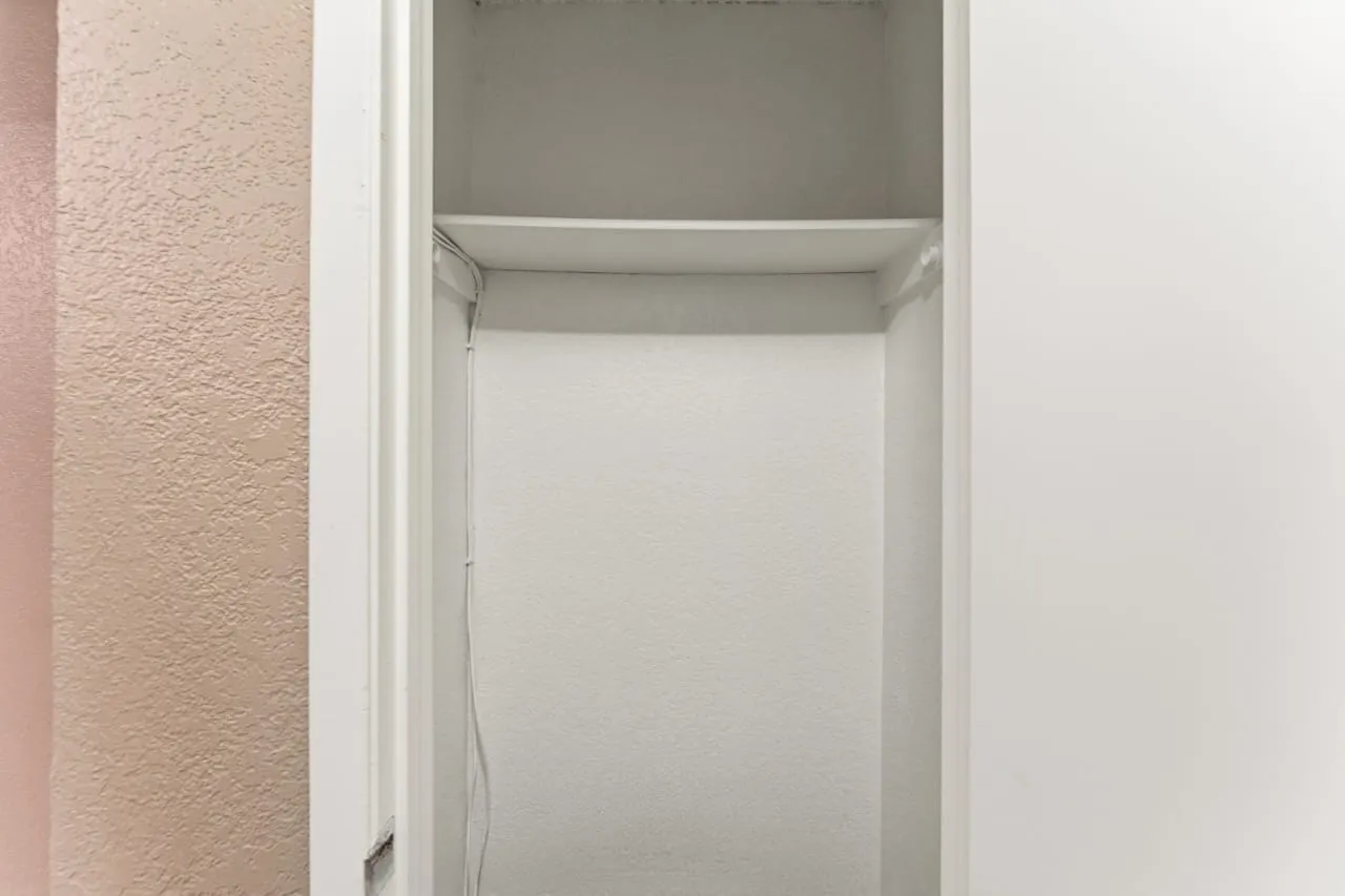 Recessed storage space with a built-in shelf