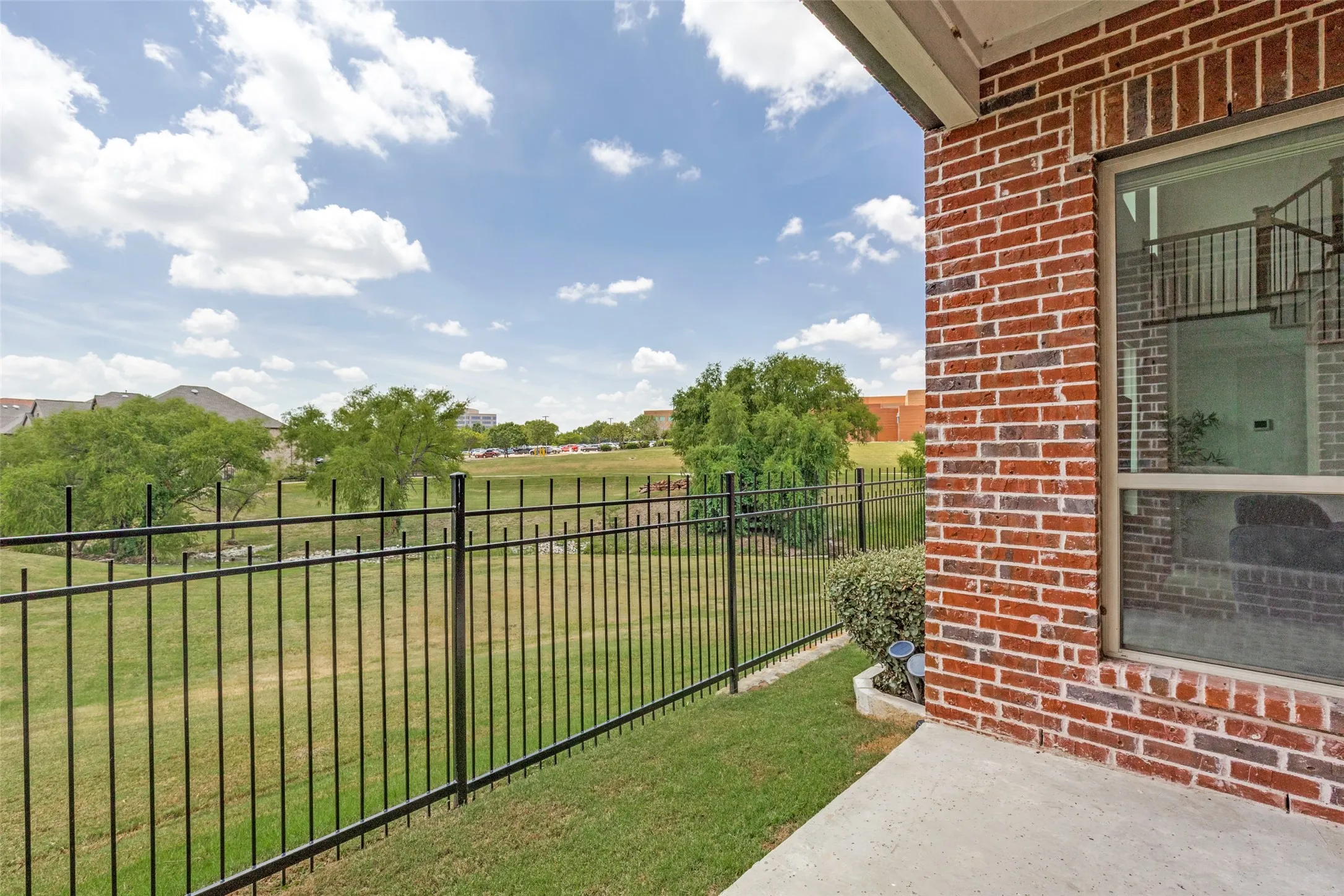 Surrounding green space provides peaceful scenery from main floor windows and backyard