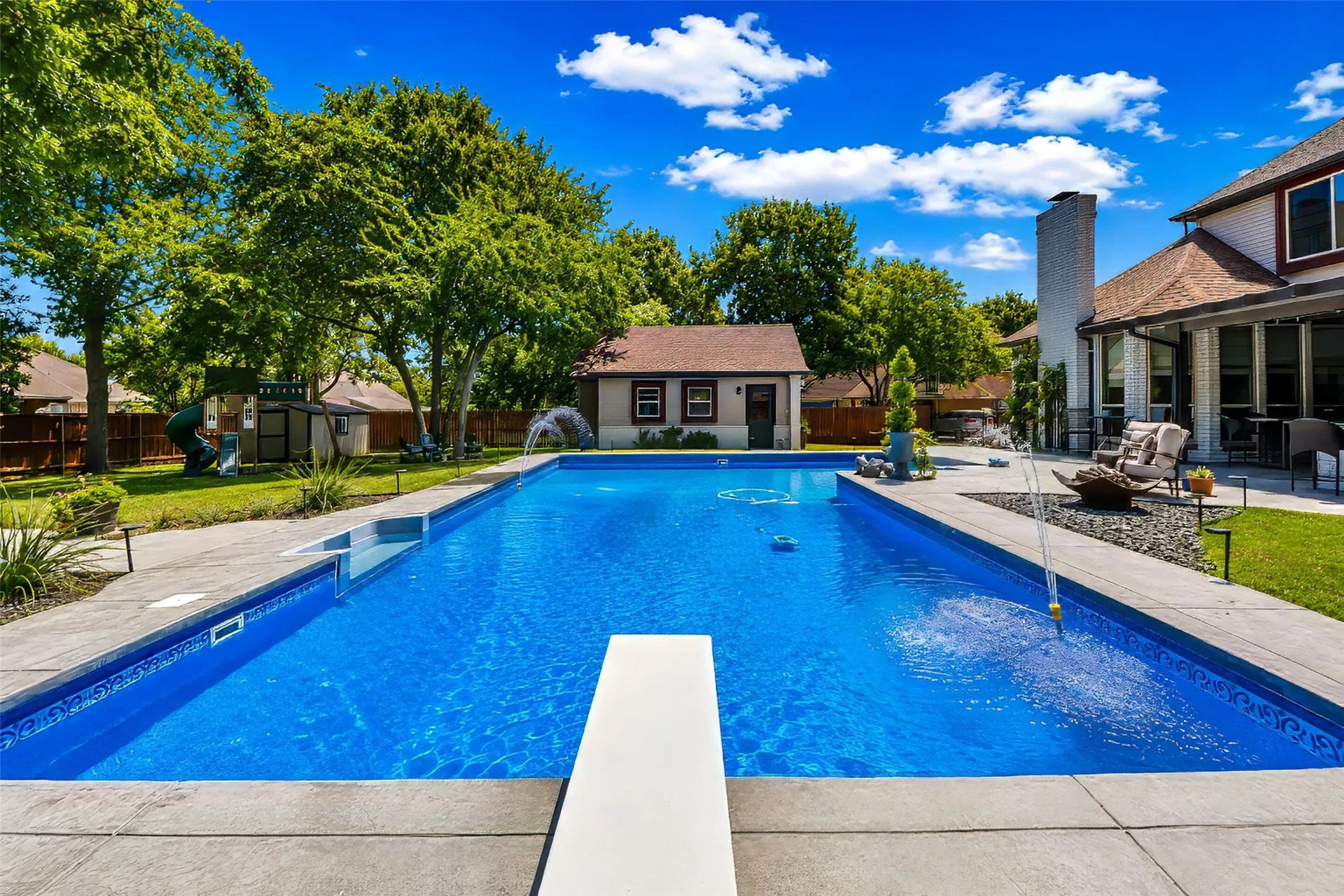 This is a diving pool with extensive textured concrete decking.