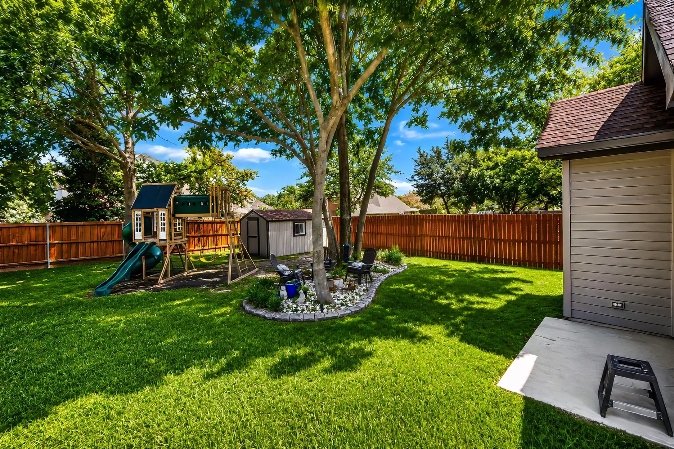 Property also features a storage shed on a concrete slab.