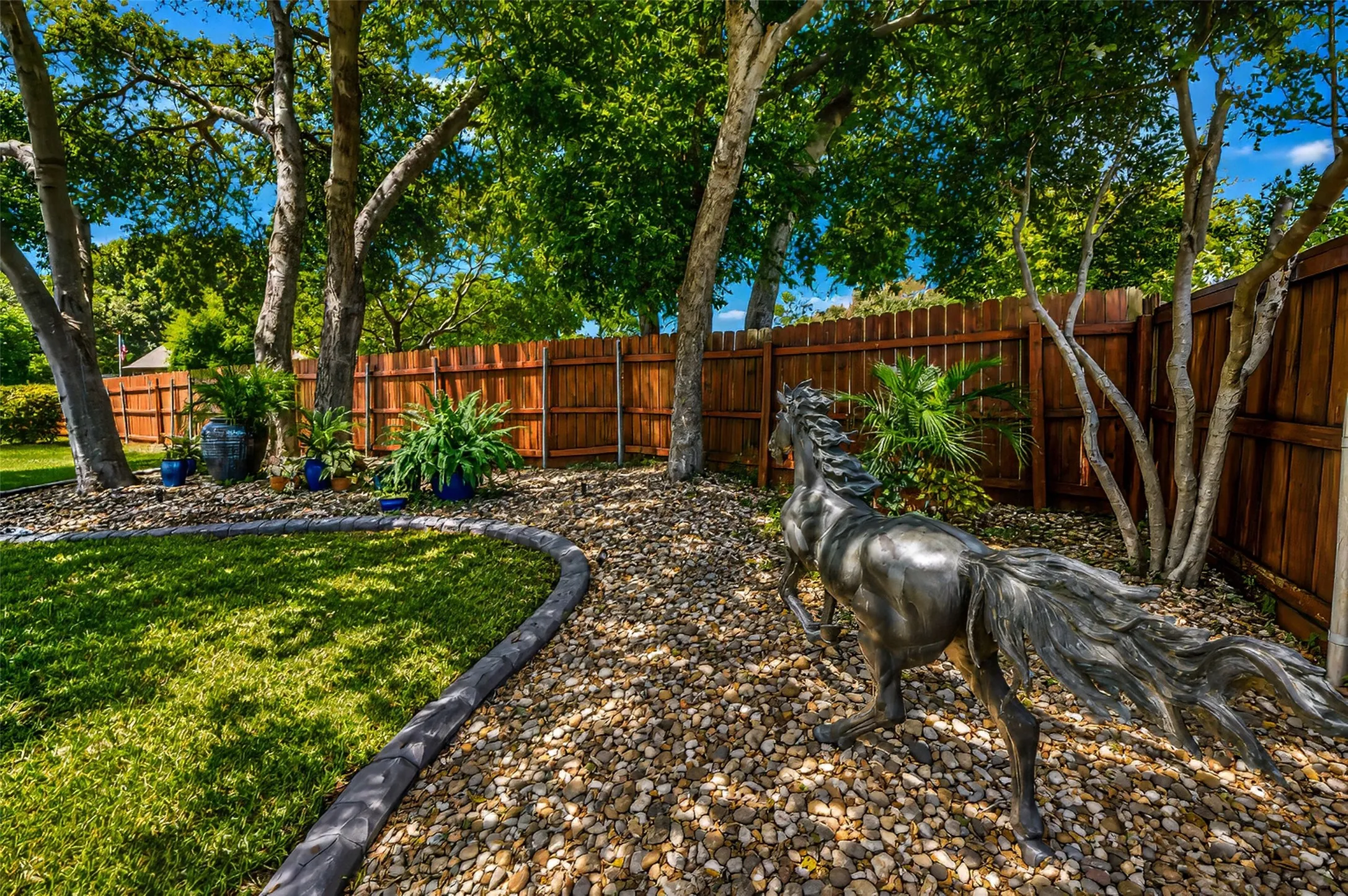 Mature trees and planter areas.
