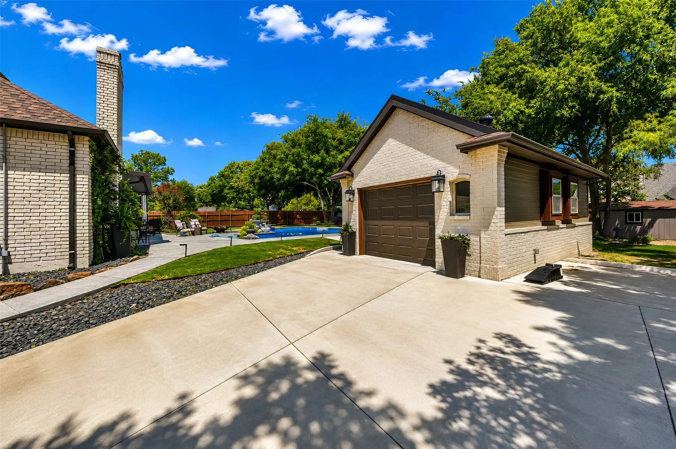 A new detached garage complements the architecture of the home.