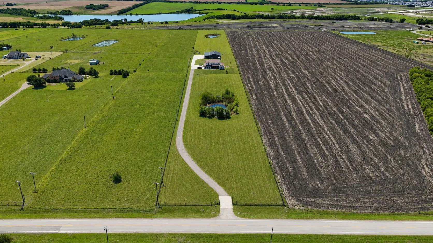 Expansive cleared land parcel with a segment of tilled earth