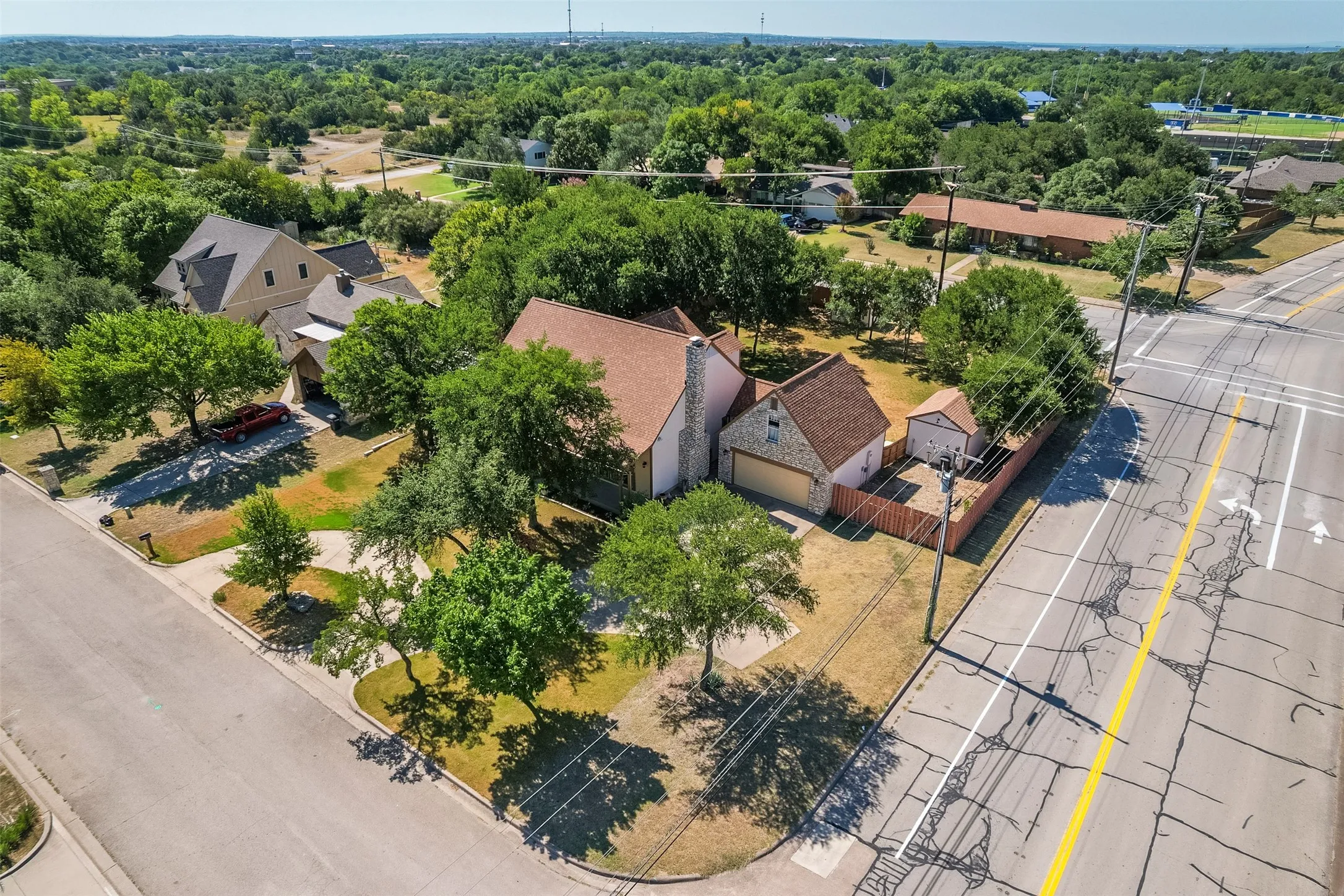 Aerial perspective highlighting a residential property with a detached accessory structure