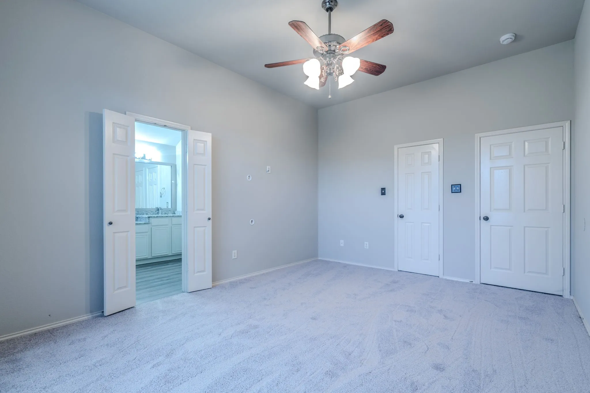 Large primary suite with his & hers walk-in closets