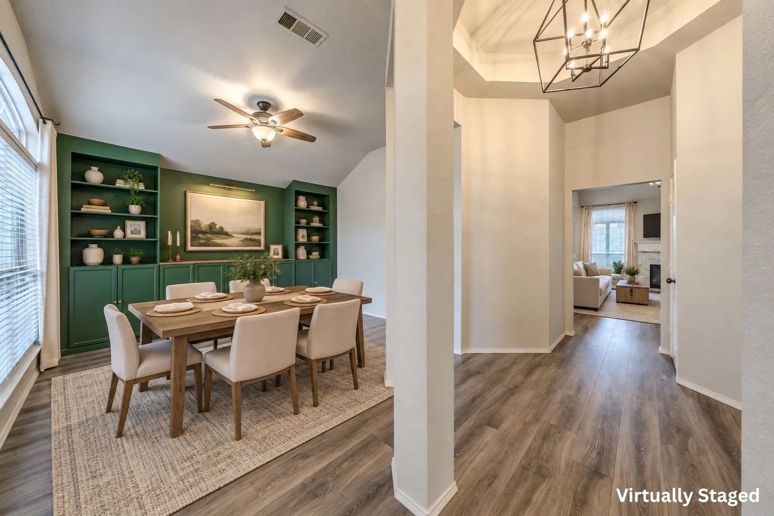 Bright, inviting dining area to the left of entryway and across from the study. Virtually staged.