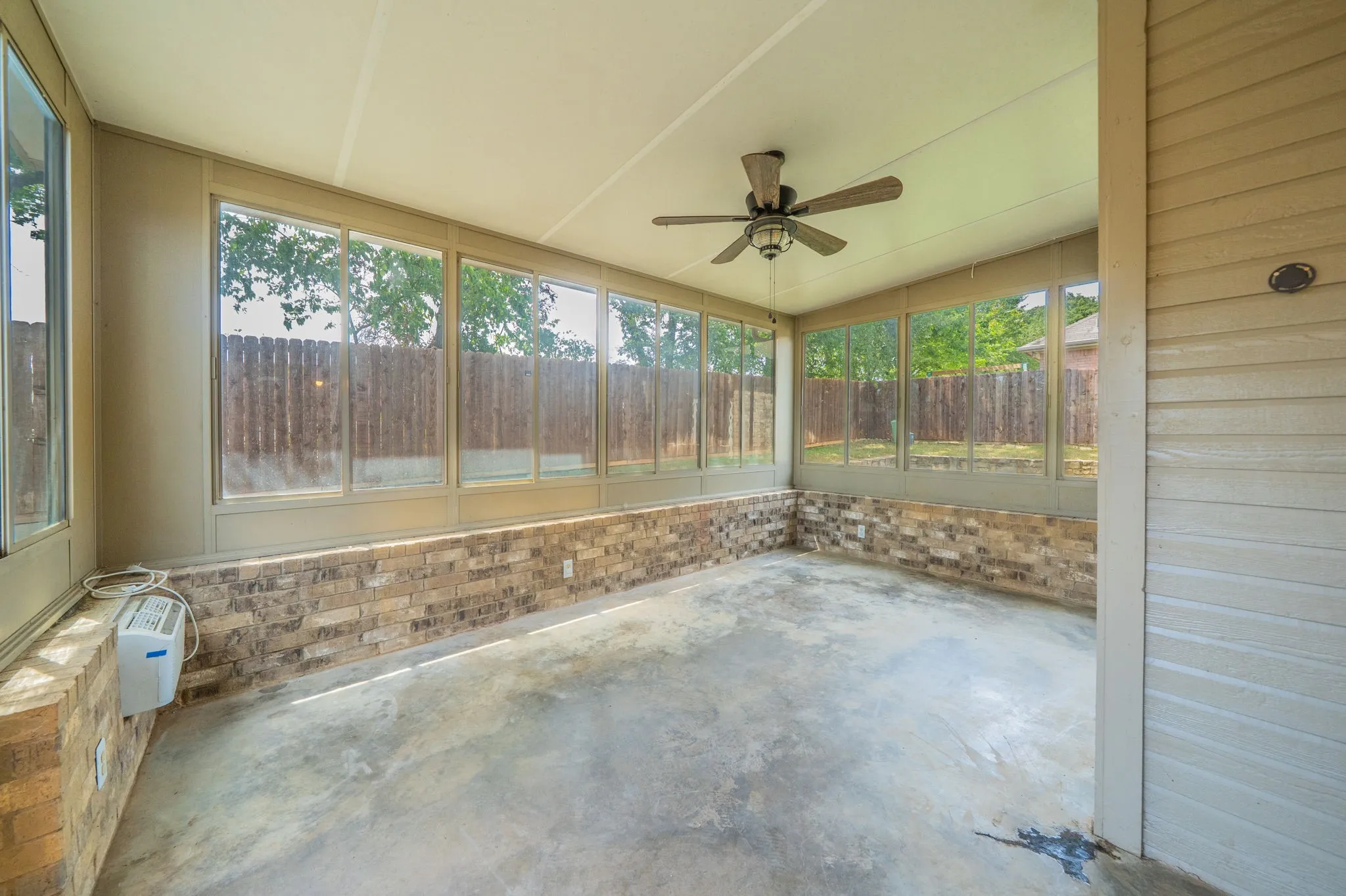 Enjoy the large enclosed sunroom year round with its dedicated AC.