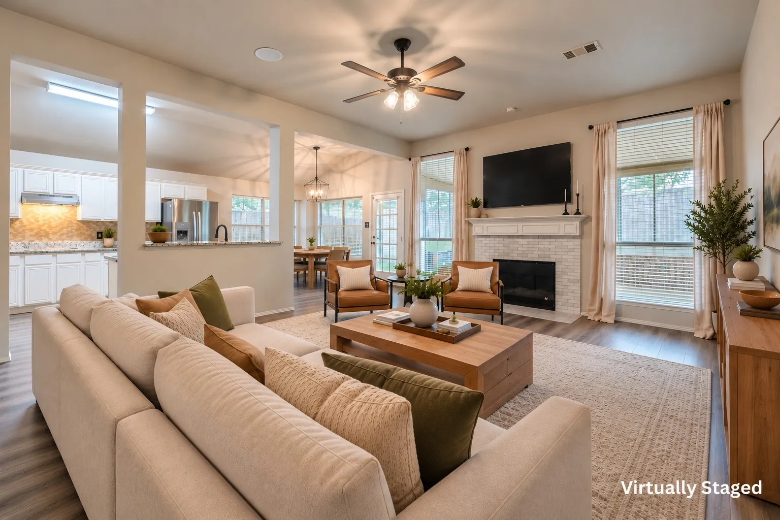 The open format between the living room, kitchen and breakfast area is perfect for hosting. Bright picture windows look out to the sunroom and backyard. Virtually staged.