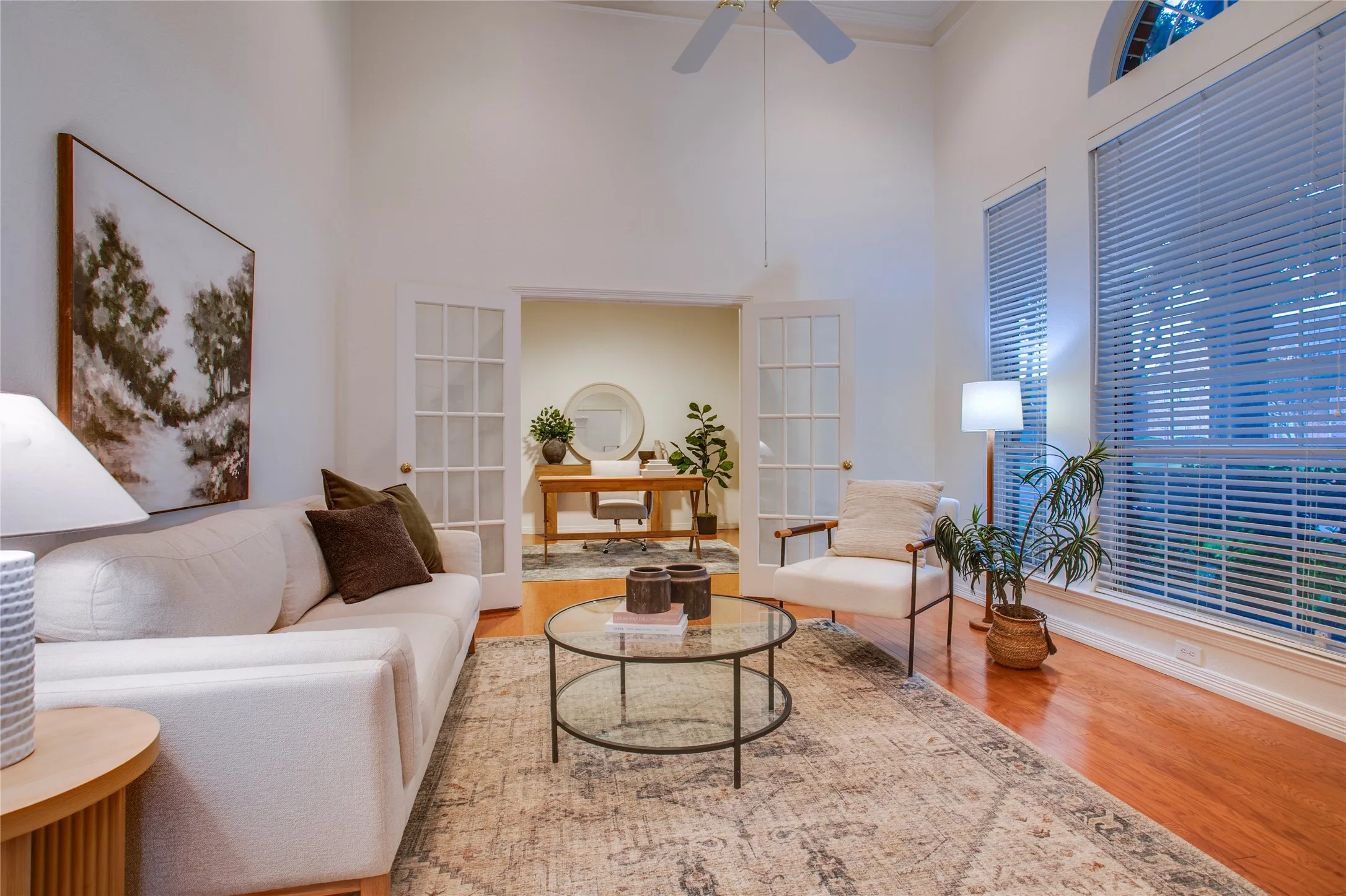 French doors fill the passageway to the study.