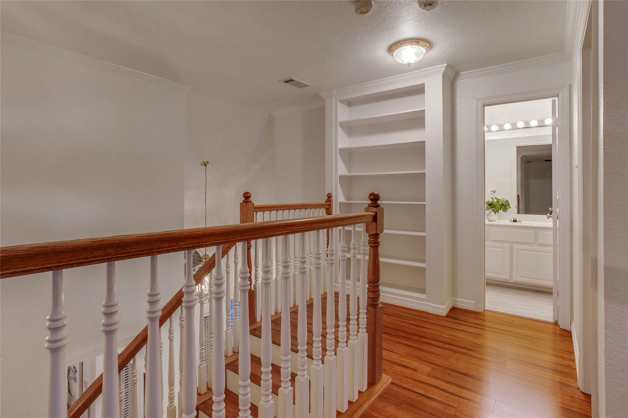 Built-in bookcase at the top of the staircase