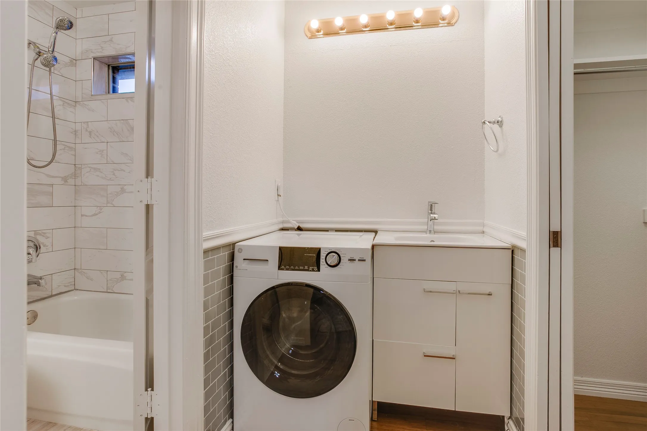 Upstairs all-in-one washer-dryer with utility sink
