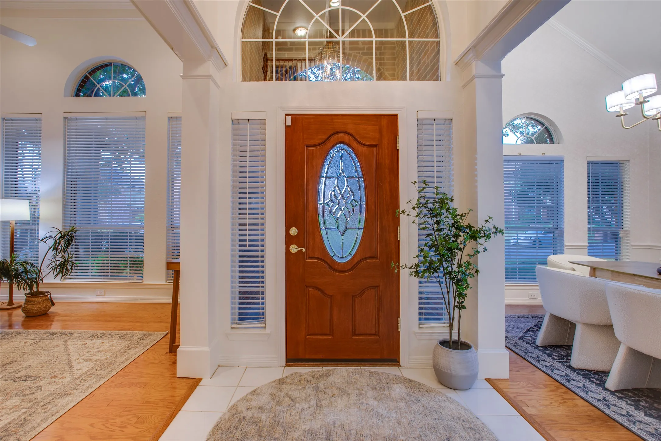 The soaring entry opens to defined formal areas with trimmed cased openings that beautifully frame the passageways.