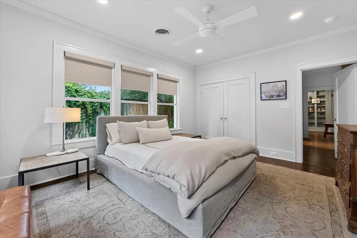Bedroom featuring multiple windows, recessed lighting, and a ceiling fan