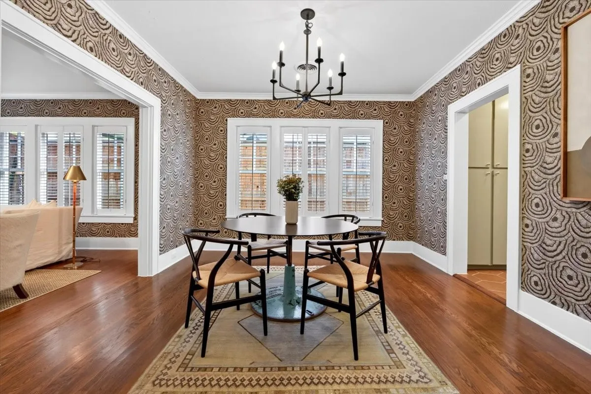 Interior space featuring hardwood flooring and patterned wall coverings