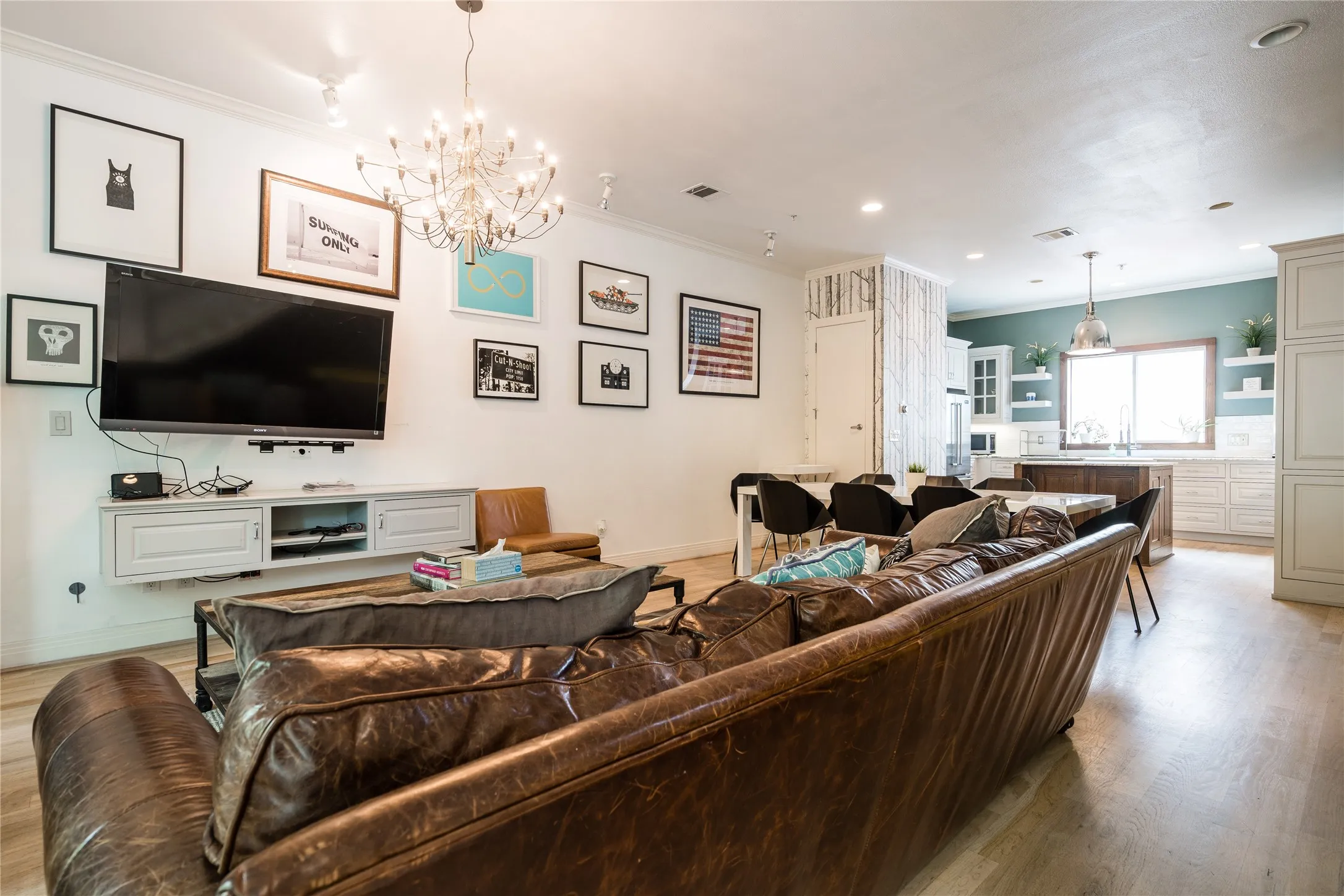 Open-concept living area featuring light wood-finish flooring throughout