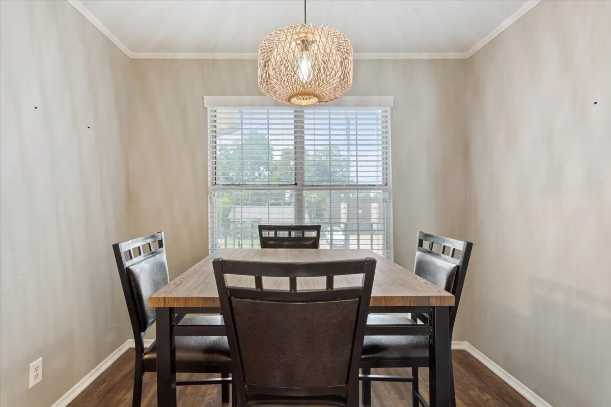 Bright dining area filled with natural light from the windows, creating a welcoming space for everyday meals or entertaining.