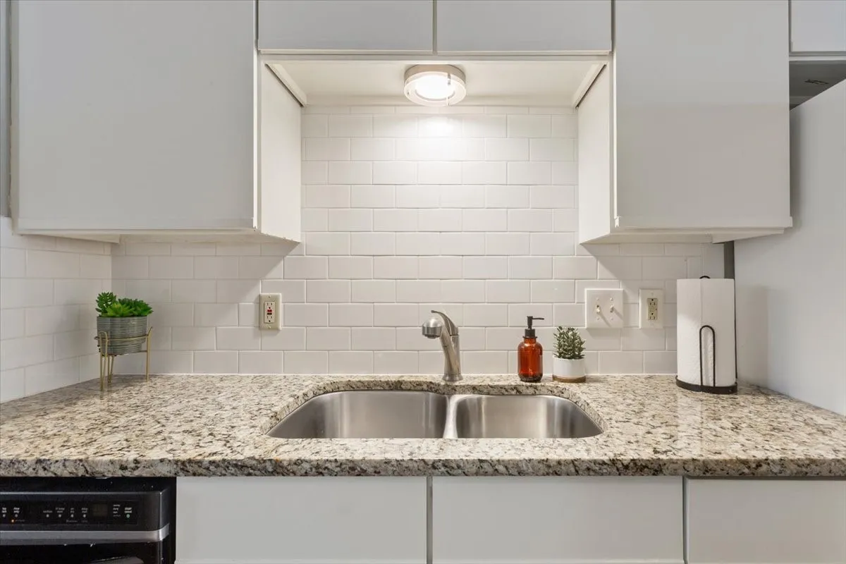 Classic subway tile backsplash and well-designed workspace add a clean, timeless feel to the kitchen.