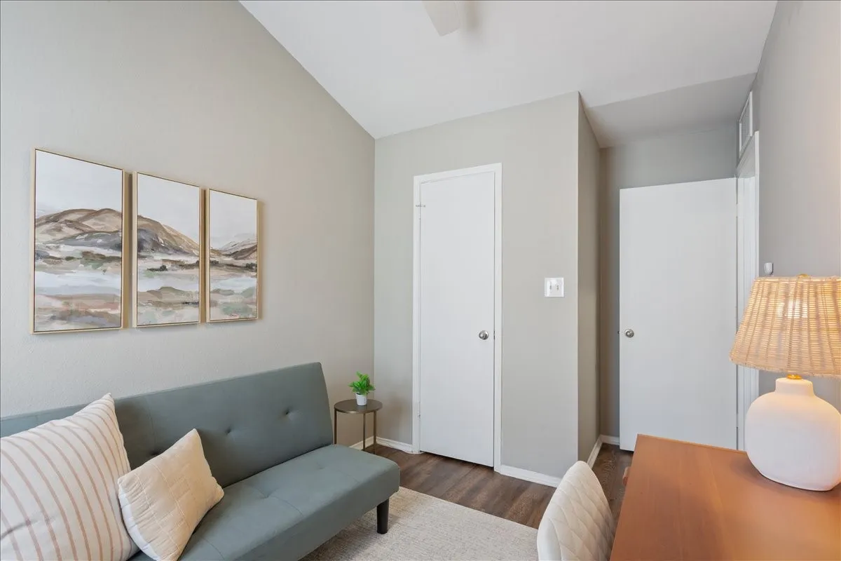Second bedroom currently styled as a home office, showcasing the flexibility of this additional living space.