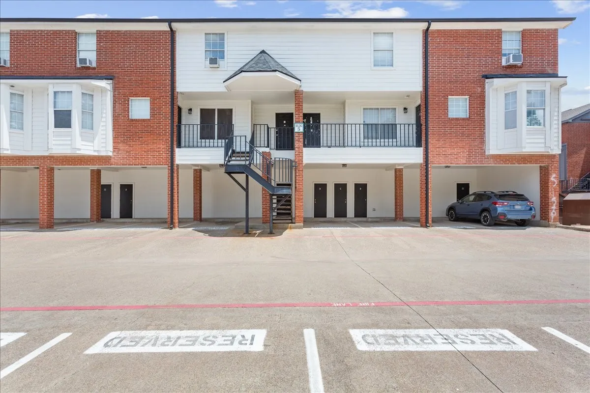 The entrance to Unit 5C welcomes you home with easy access to parking and the community courtyard.