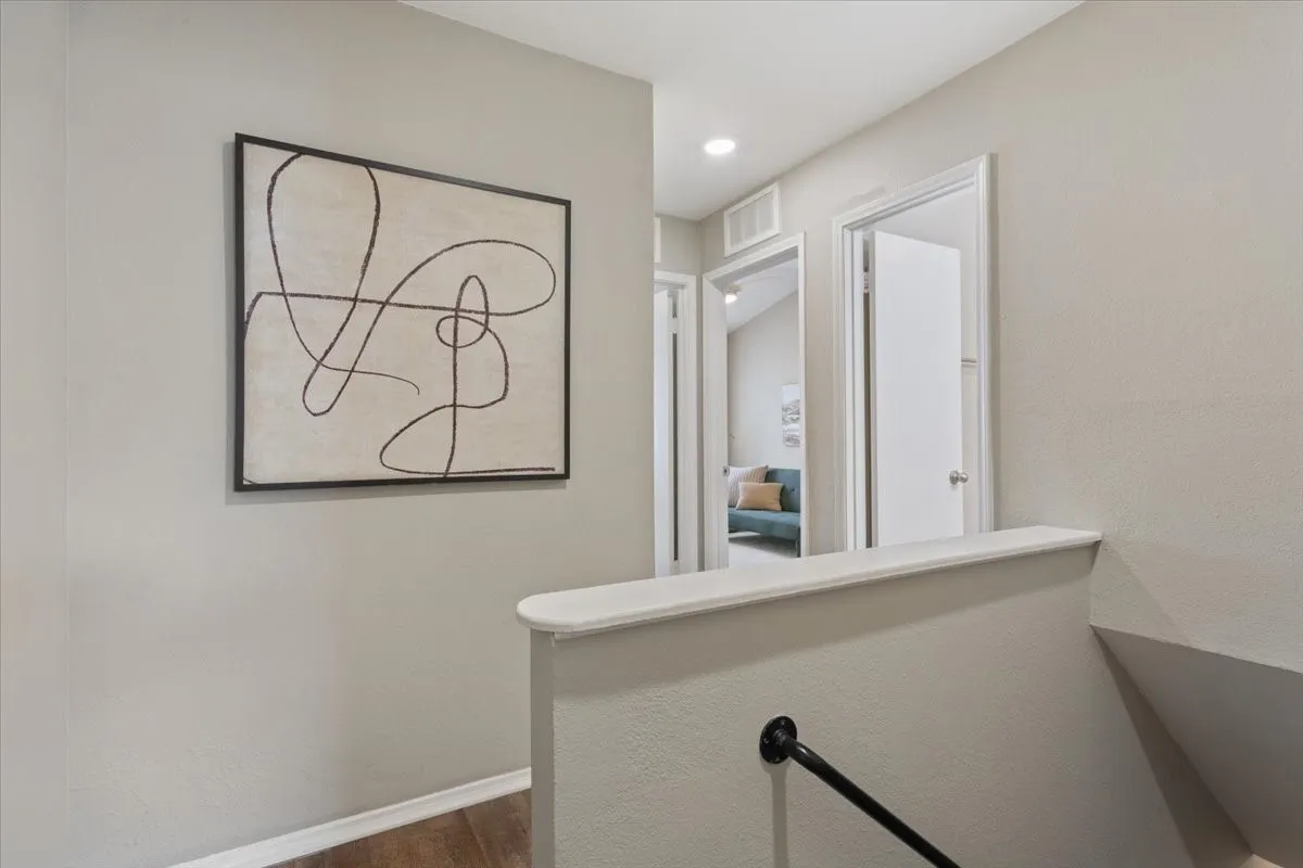 Upstairs landing provides easy access to all three bedrooms and two full bathrooms.