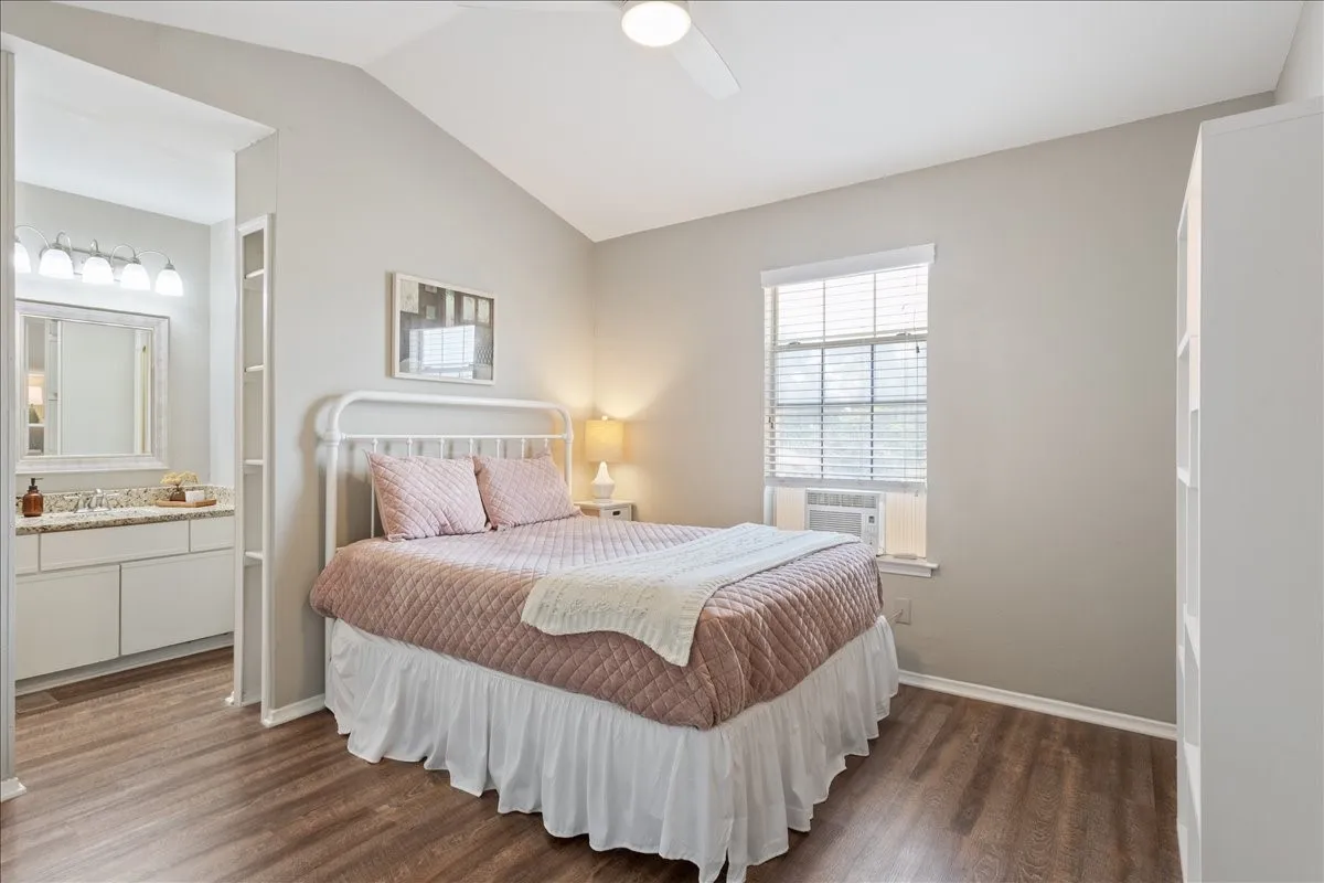 Primary bedroom offers excellent storage with two walk-in closets and a comfortable layout for everyday living.