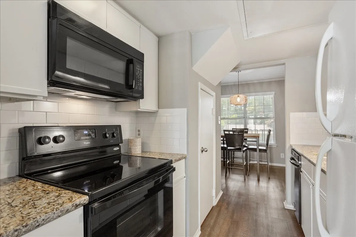 Efficient galley kitchen layout with a convenient connection to the dining and living areas.