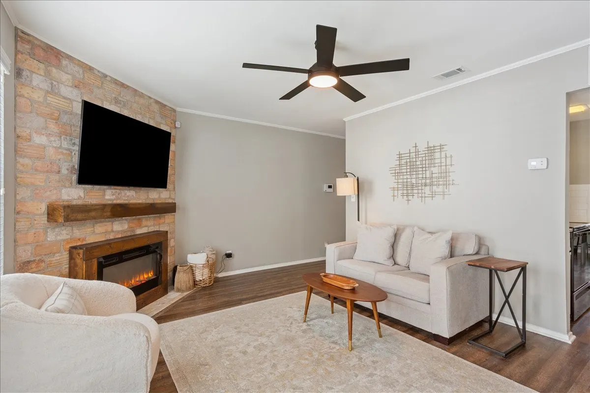 Bright and inviting living room filled with natural light, showcasing the home's spacious layout and clean, modern finishes.