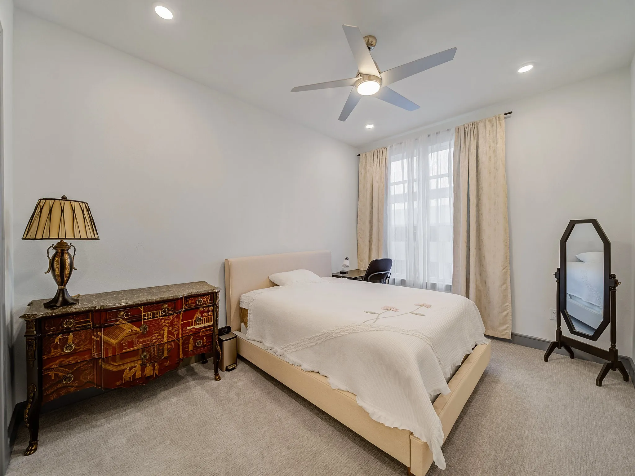 Room featuring light-colored carpet flooring, recessed lighting, and a ceiling fan