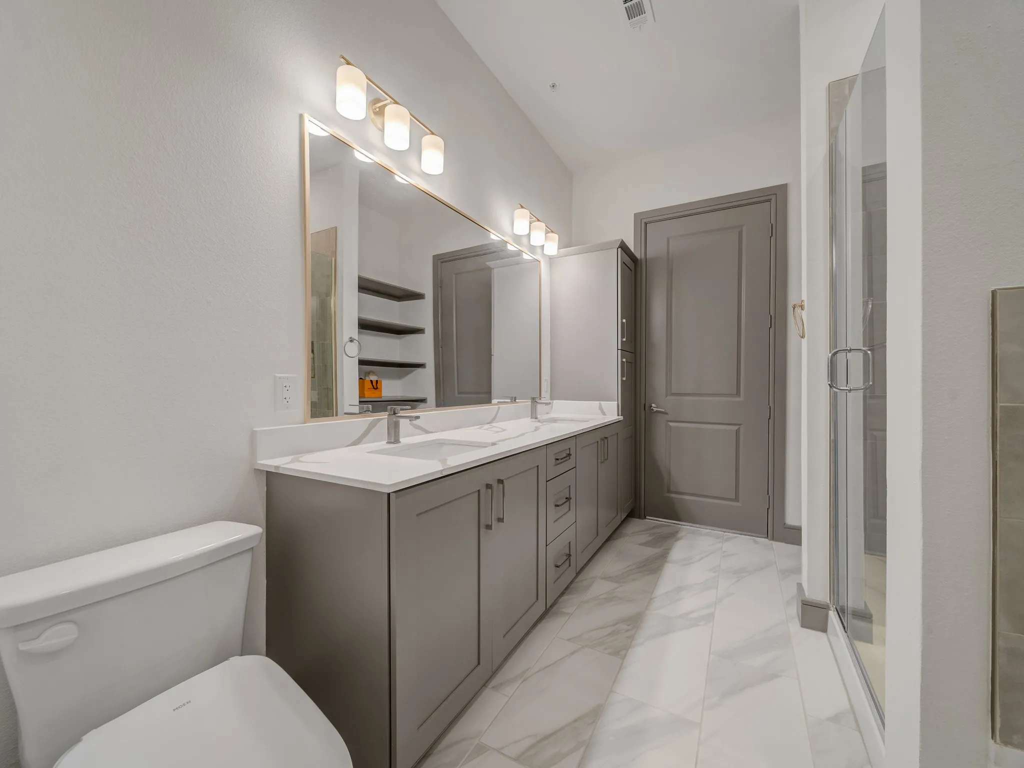 Double vanity with integrated sinks and quartz countertops