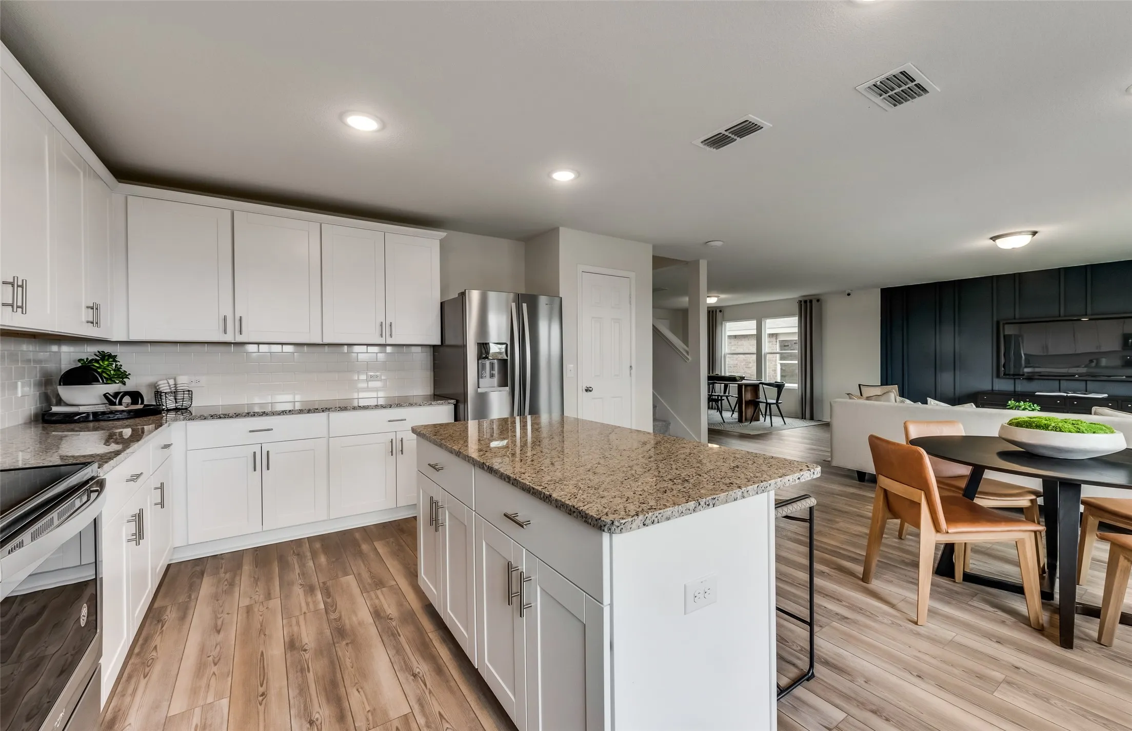 *Model Representation - Large island overlooking gathering room and dining areas