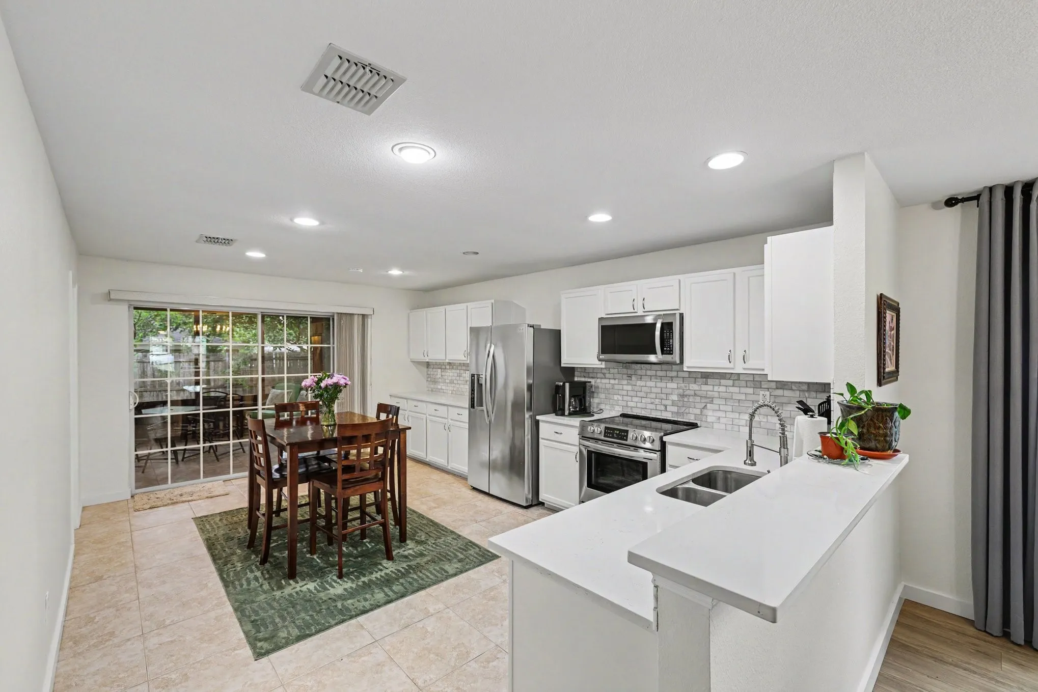 Huge kitchen with quartz counters, stainless appliances, double sink