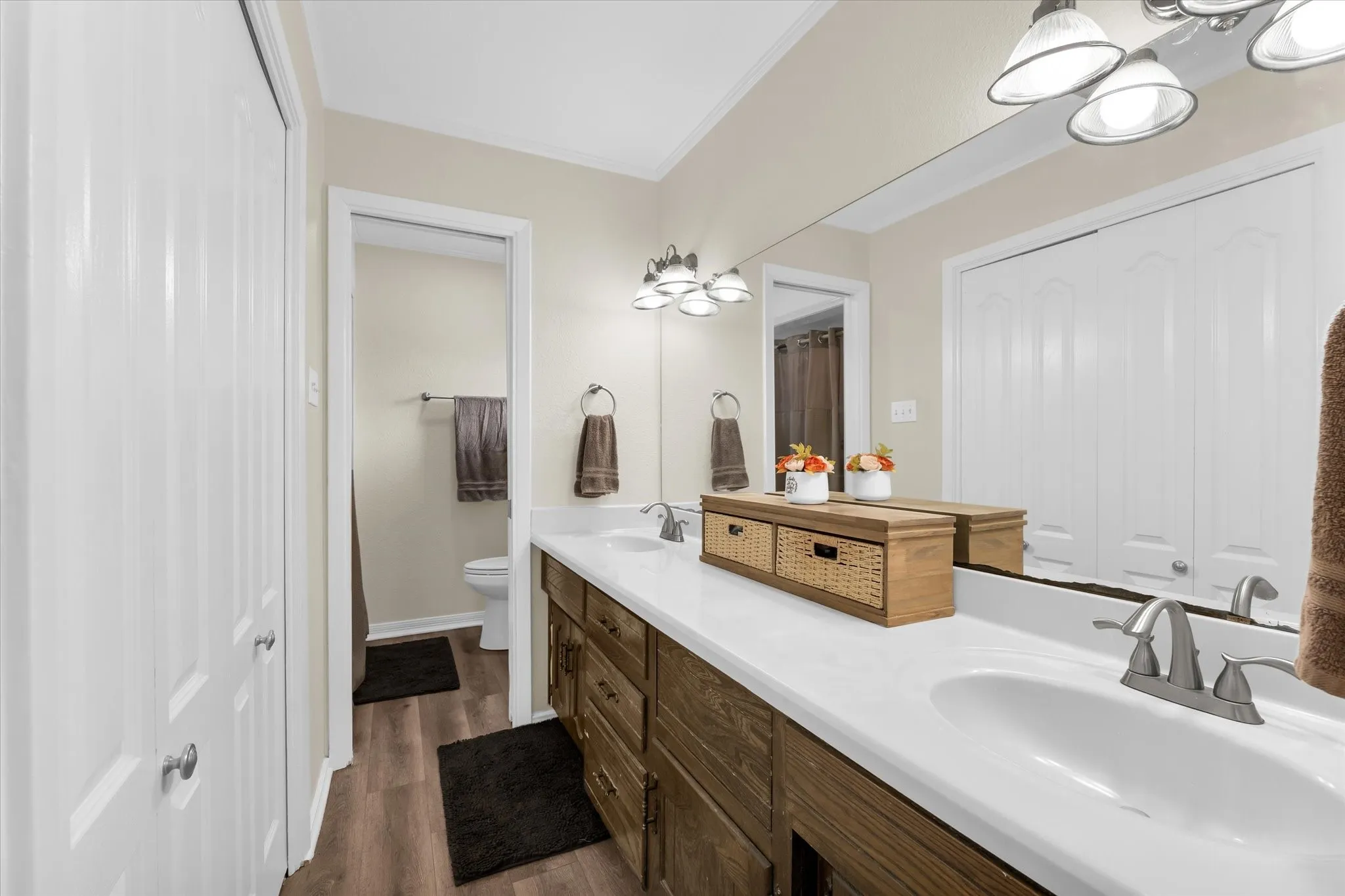 Bathroom vanity with dual undermount sinks and individual chrome faucets