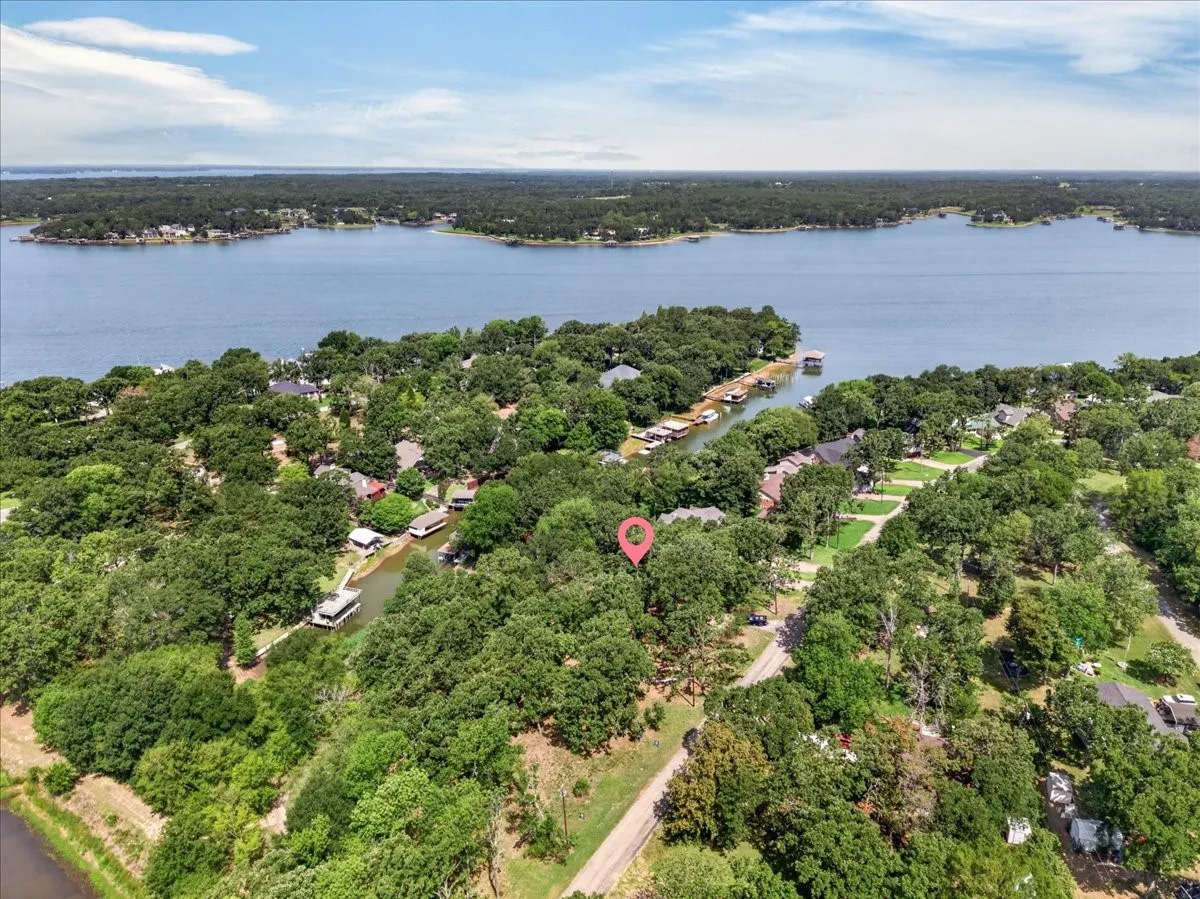 Aerial drone view including the Property marker, view of the channel and how close the open water is