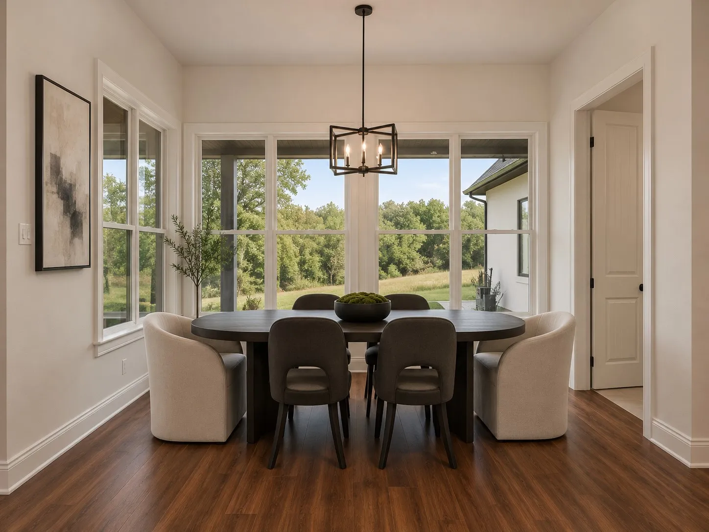Expansive window array, wood-finish flooring, recessed lighting, and a modern rectangular chandelier