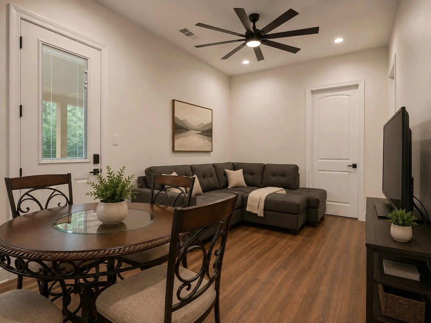 Wood-finish flooring, recessed lighting, and a contemporary ceiling fan