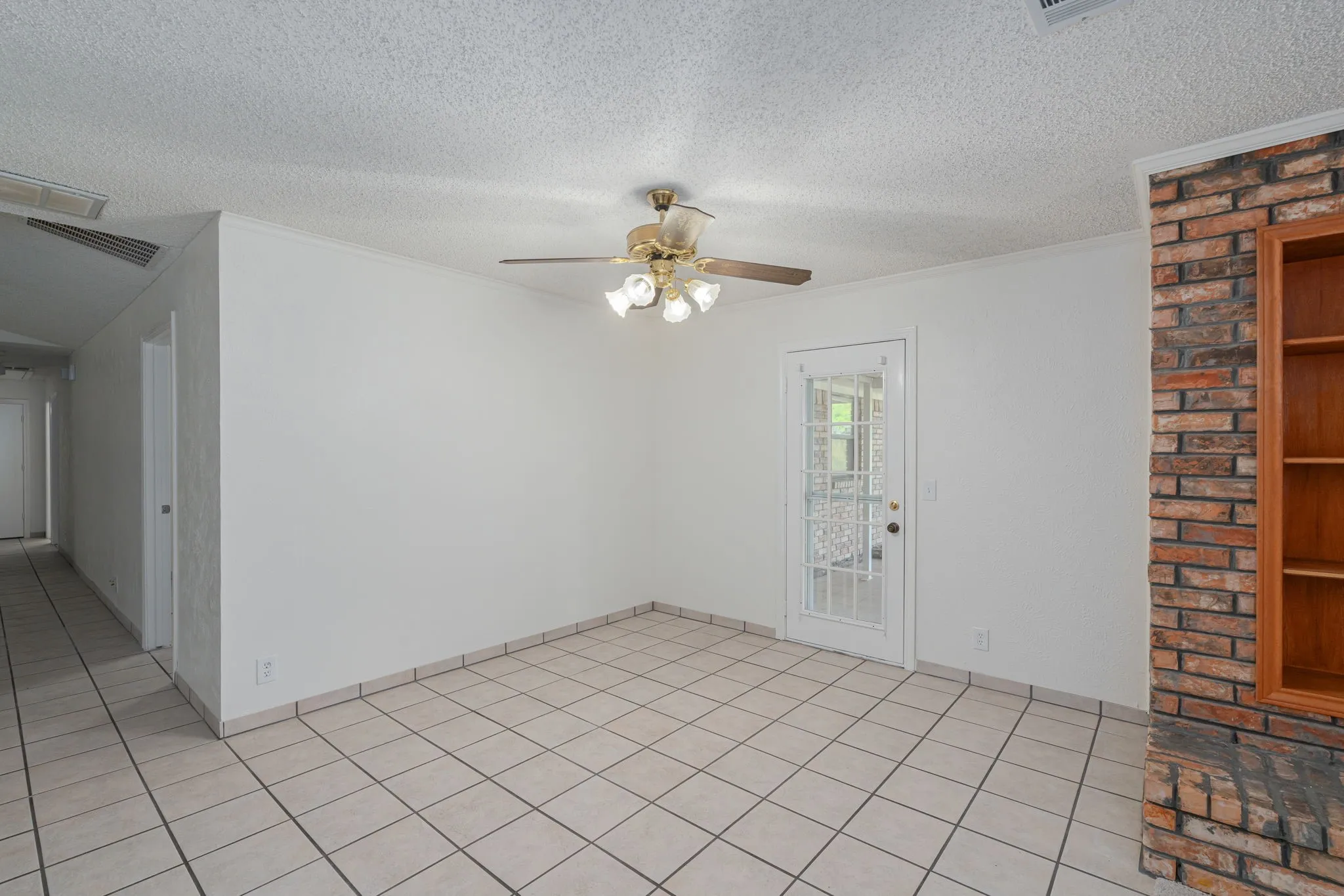 Bright dining space offers easy access to the covered patio, creating a seamless indoor-outdoor entertaining experience.