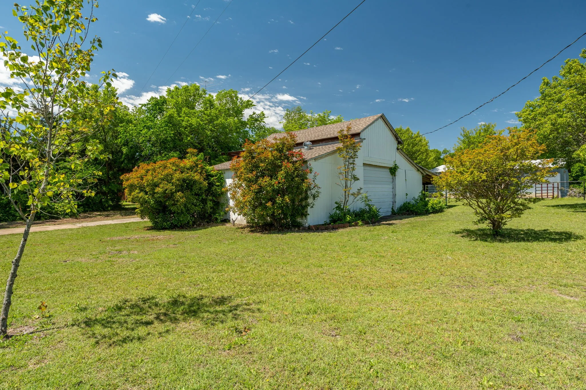 Oversized detached garage with additional workspace provides endless possibilities for hobbies, storage, or equipment.