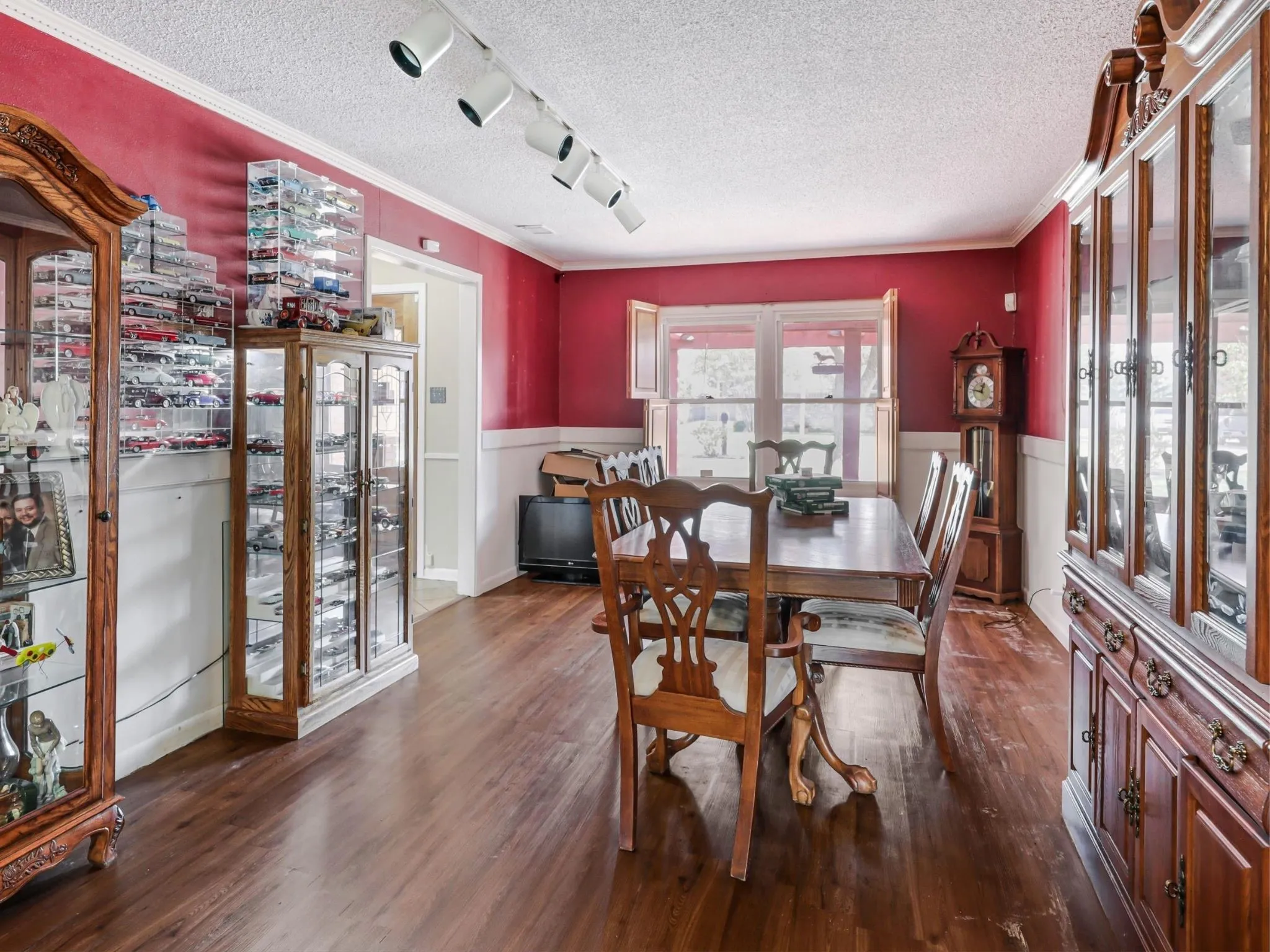 The formal dining room is filled with natural light and features charming interior wood shutters, making every meal feel just a little more special.