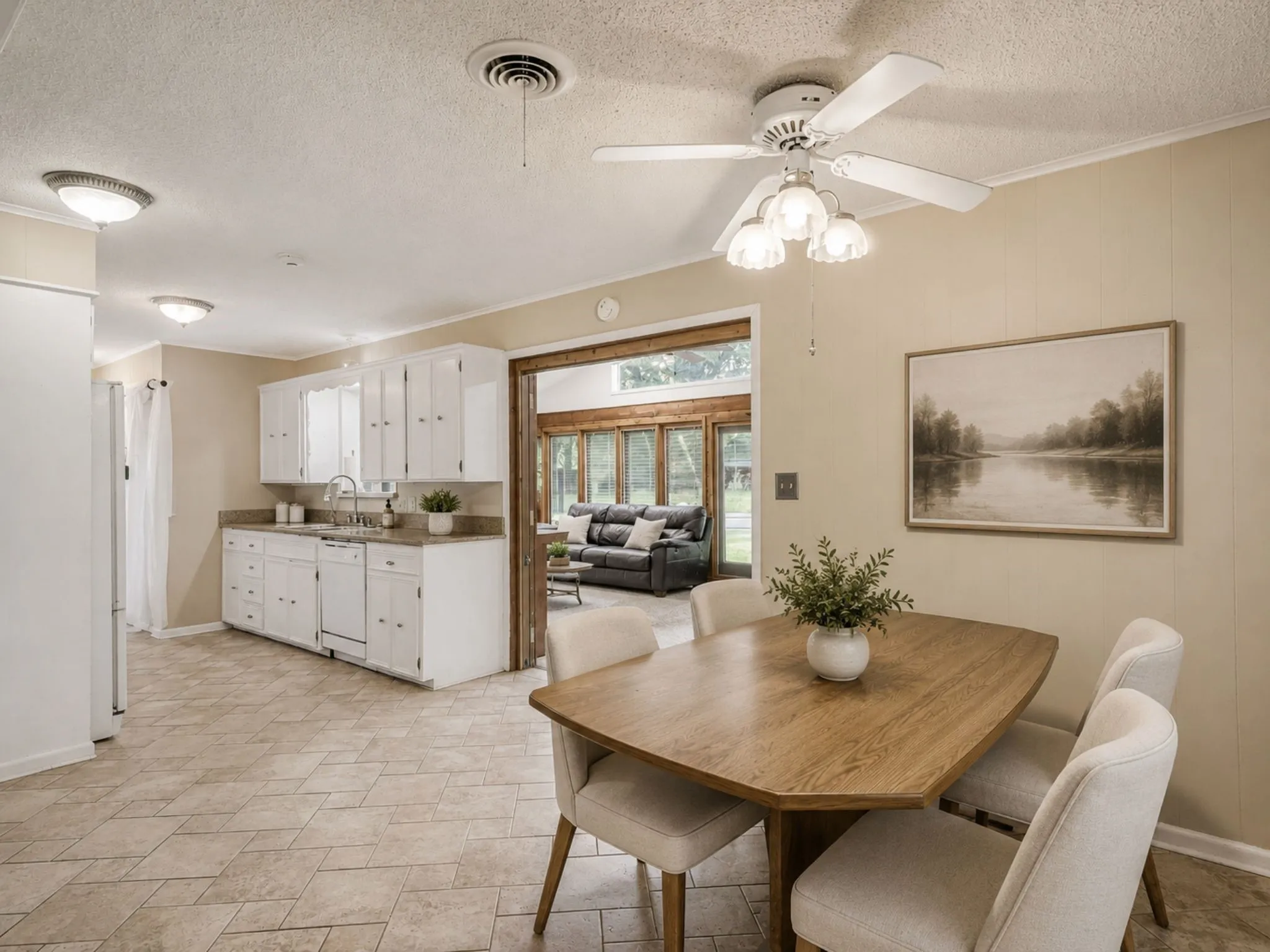 Simple cosmetic updates create a bright, welcoming breakfast nook where morning coffee and family dinners naturally come together.