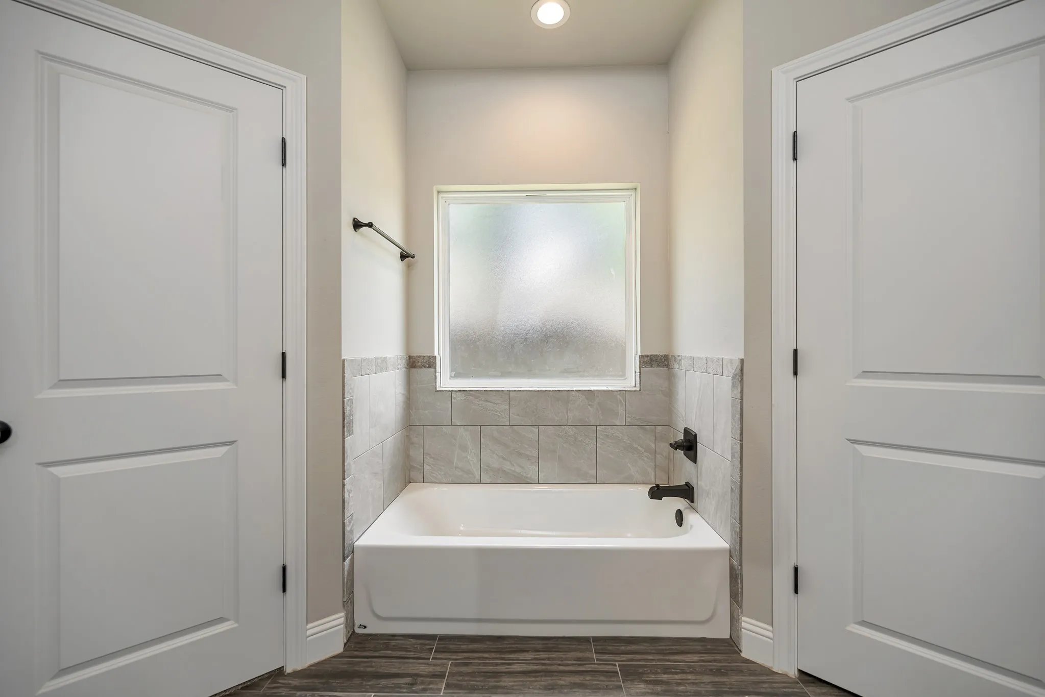 Tub close up with large window for natural light.