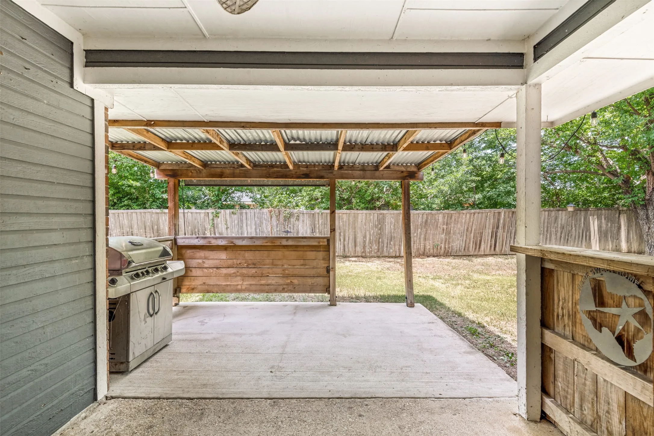 Outdoor covered patio with concrete flooring