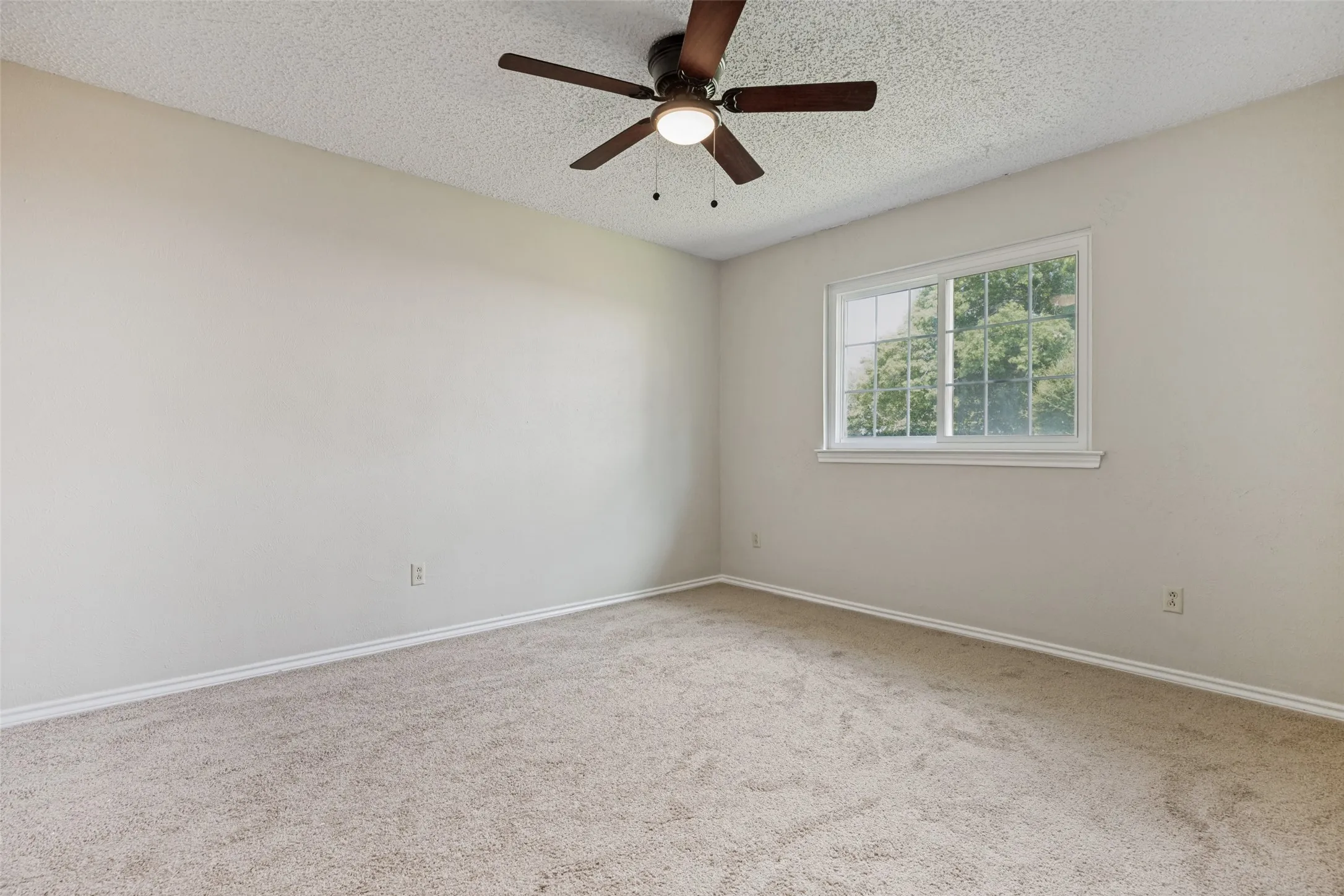 New carpet and ceiling fan.