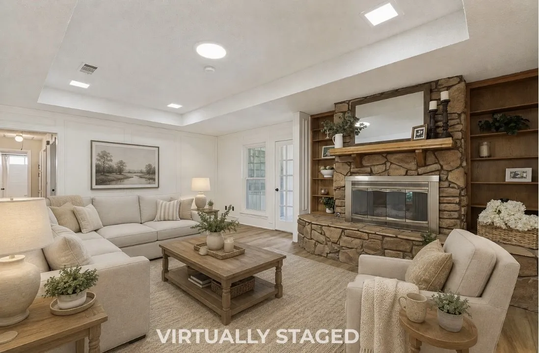 Stone-clad fireplace with metal insert, built-in wood shelving, wood-finish flooring, and recessed ceiling lighting